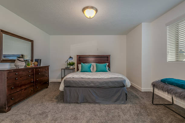 istock Basement bedroom staged and ready for showing off 1256383403
