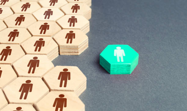 istock Human figurine outside company's overall system. Separation from group, promotion. To be different. Recruiting new employees to vacant places. Key person, team leader. Cooperation improves efficiency. 1256385232