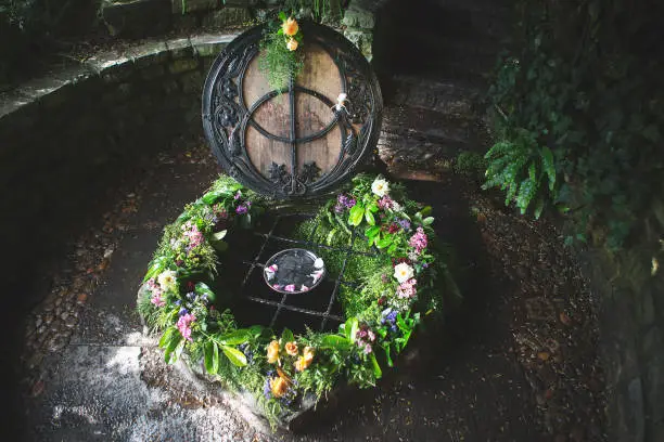 Chalice well dressed with a floral wreath