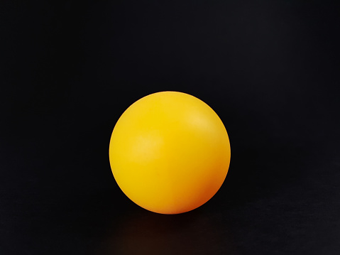 Orange Ping Pong Ball, Isolated on Black Background