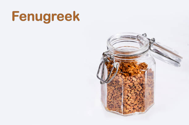 istock Dried fenugreek seeds in the jar - Trigonella foenum-graecum 1256391730