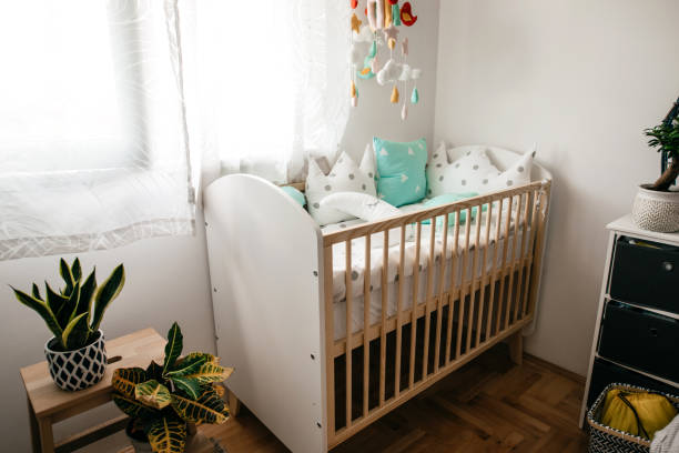 istock Empty crib in a nursery at home 1256393374