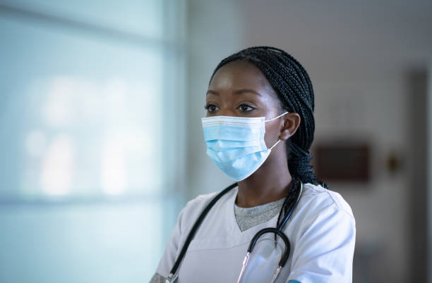 istock Nurse attending to patient's needs during Covid-19 1256397568