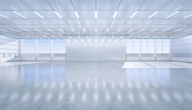 istock 3d rendering of large hangar building and concrete floor and open shutter door in perspective view for background, clean and new condition. 1256402000