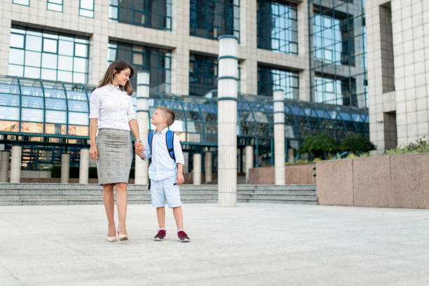 istock Mother taking her little son to school. 1256403977