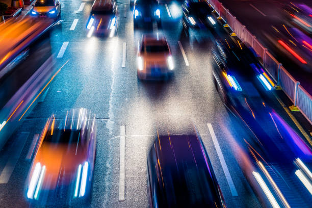istock moving car with blur light through city at night 1256404827