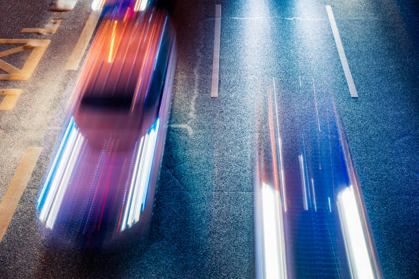 istock moving car with blur light through city at night 1256404847