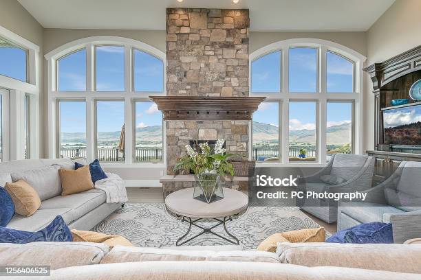 Amazing Symmetrical Windows On Each Side Of The Giant Stone Fireplace Stock Photo - Download Image Now