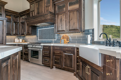 Blue tile backsplash and granite countertops in luxury kitchen