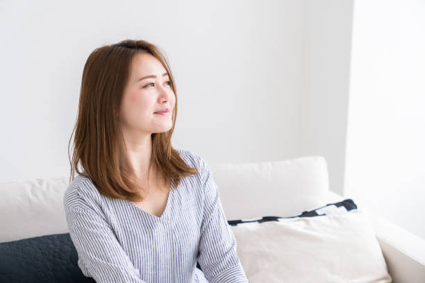 istock asian woman relaxing 1256411491