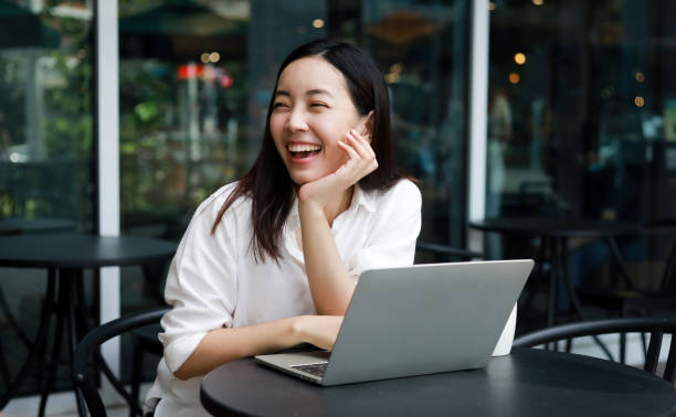 istock Asian woman working in cafe 1256411612
