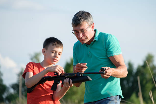 istock Father and Son Rifle Lessons 1256415946