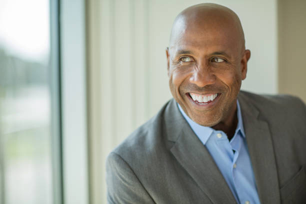 istock Happy mature African American man at work. 1256416214
