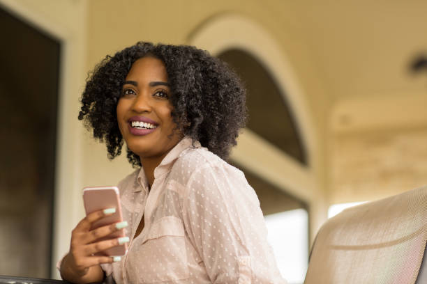 istock African American woman texting. 1256416262