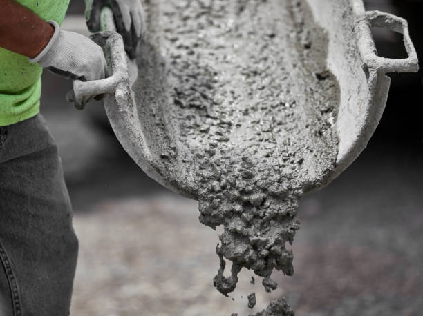 Construction Worker holding a Cement Shute stock photo