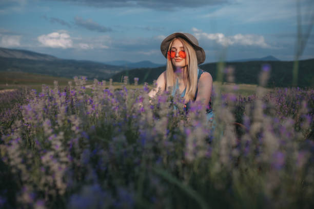 Young Female enjoying summer day in lavender fields