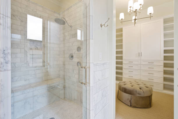 istock Luxurious and large en suite shower next to oversized walk in closet 1256425341