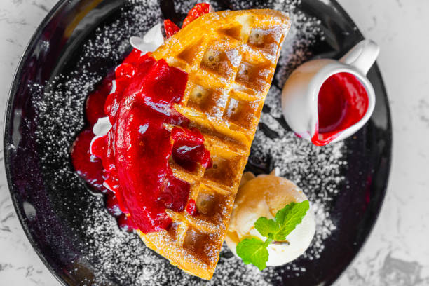 istock Waffles with strawberry and Vanilla Ice Cream 1256425431