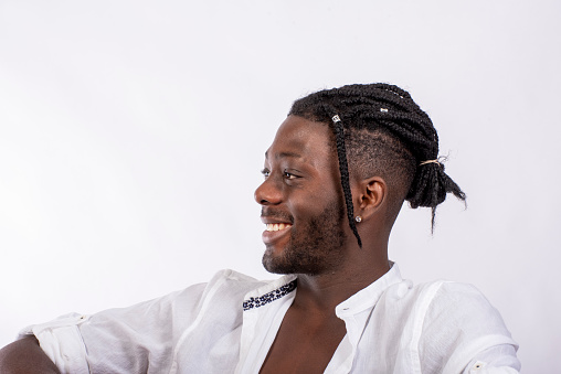 Profile of young west African man smiling.