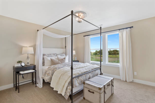 istock Luxurious bedroom with canopy four poster bed 1256427085