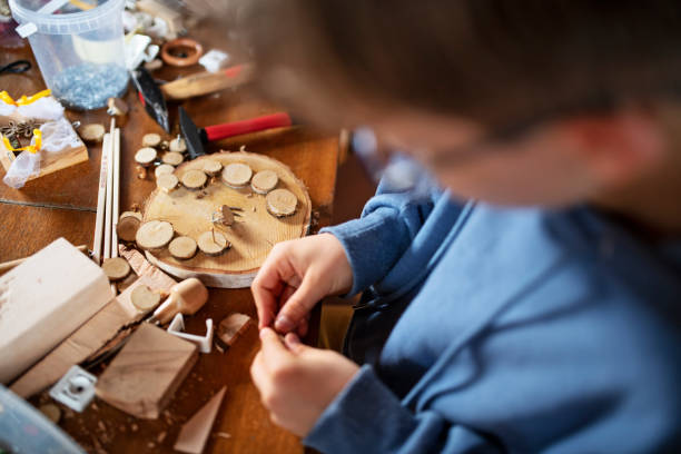 istock Little boy enjoying crafting and carpentry 1256428052