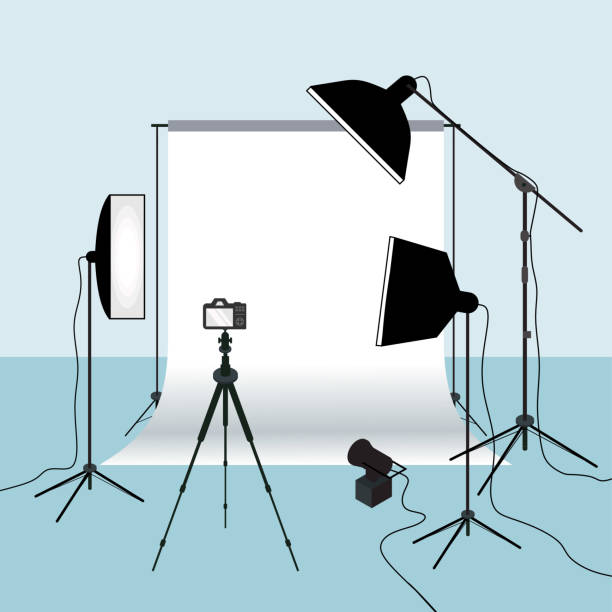 Photography equipment flat vector illustration, white background for taking picture. Photo studio white blank background with light, camera, tripod and set of backdrop. Cameraman tools Photography equipment flat vector illustration, white background for taking picture. Photo studio white blank background with light, camera, tripod and set of backdrop. Cameraman tools photographic equipment stock illustrations