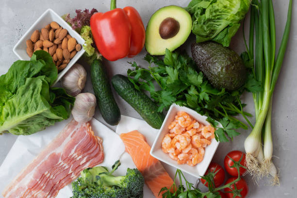 Keto diet concept. A set of keto nutrition products. Fresh vegetables, seafood, bacon and nuts. Keto diet concept. A set of keto nutrition products. Fresh vegetables, seafood, bacon and nuts atkins diet stock pictures, royalty-free photos & images