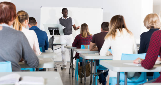 istock African American teacher giving presentation for students 1256437513