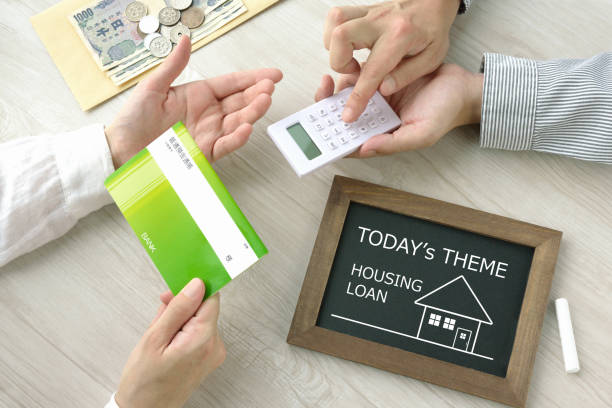 istock Couple talking about housing loan 1256438775