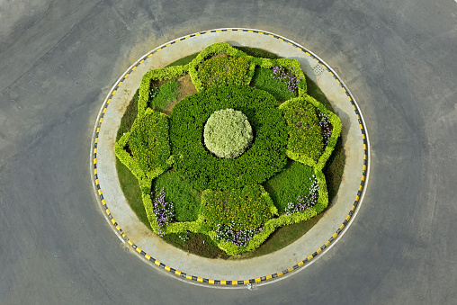 Top aerial view of the roundabout park on the road in New Delhi India.