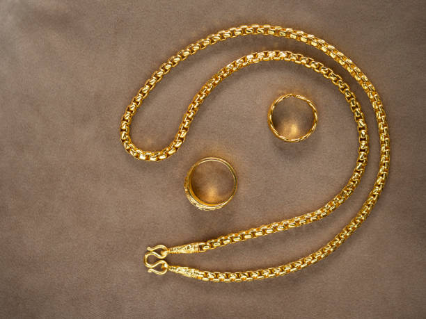 istock Gold necklace and couple ring set. 1256444004