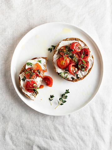 bun with cheese and tomato isolated on white background