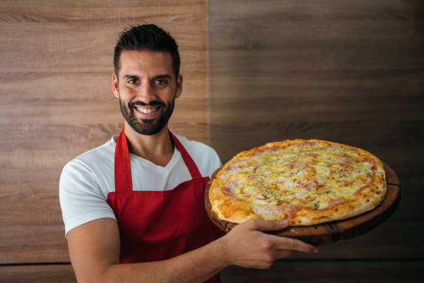 istock Portrait of smiling baker 1256444362