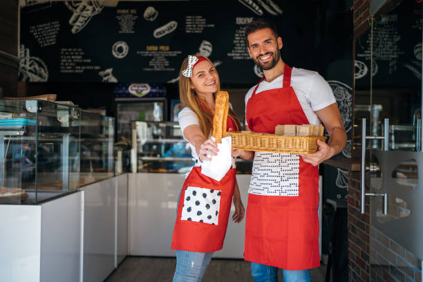 istock Portrait of smiling bakers 1256444418