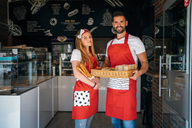 istock Portrait of smiling bakers 1256444489