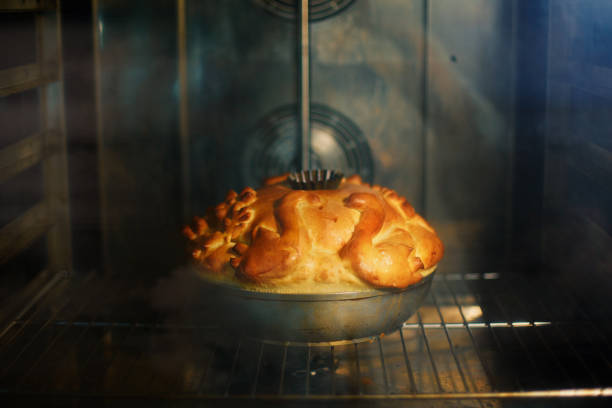 Traditional Russian wedding bread is baked in the oven. Korovai
