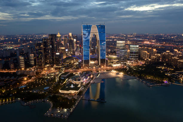 CBD buildings by Jinji Lake at night in Suzhou, China. CBD buildings by Jinji Lake at night in Suzhou, China. Urban architecture photography. suzhou stock pictures, royalty-free photos & images