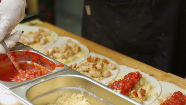 Cooking and street food concept - smoking hot tortilla wraps on tray