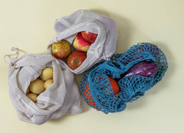 istock Zero waste shopping. Various textile bags with fruits and vegetables 1256449183