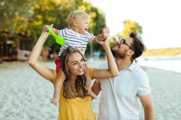 istock A young couple and their son at the beach having fun 1256450191
