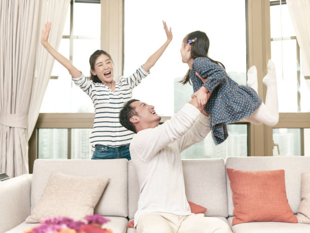 istock asian family with one child 1256451172