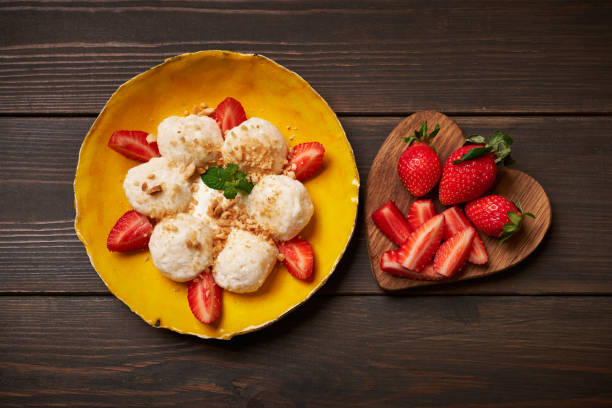 Cottage cheese dumplings with strawberry. Boiled, breakfast. stock photo
