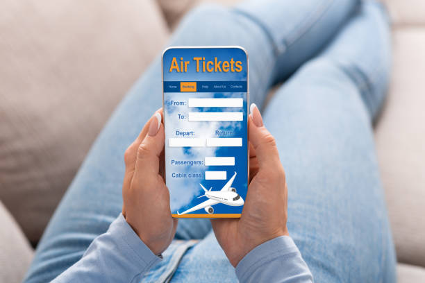 istock Woman Booking Flight Using Smartphone Sitting At Home, Cropped, Collage 1256457478