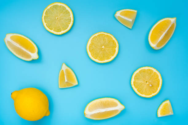 istock Variety of lemon slices on blue background top view. 1256457514