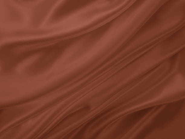 istock Beautiful elegant wavy brown satin silk luxury cloth fabric texture. 1256460428
