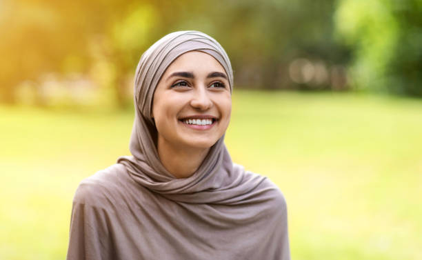 istock Happy young arab woman spending time at public park 1256460628