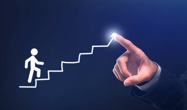 istock Businessman's Hand Drawing Staircase Steps For Stickman, Blue Background, Collage 1256463254