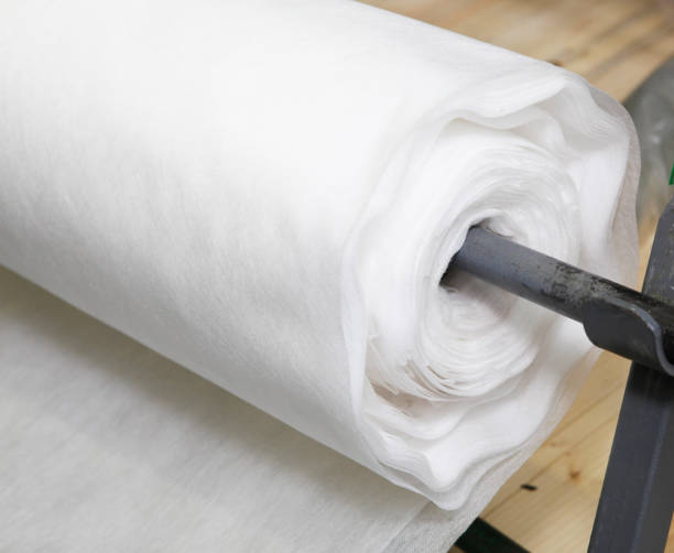 istock A close-up on white biodegradable polypropylene spunlaid, spunbond, nonwoven fabric roll. 1256463283