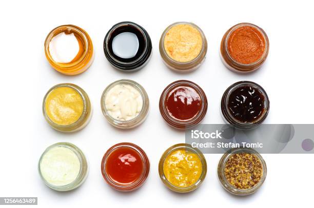 Large Collection Of Sauces And Spiced Spreads In Small Jars Isolated Flat Lay Stock Photo - Download Image Now