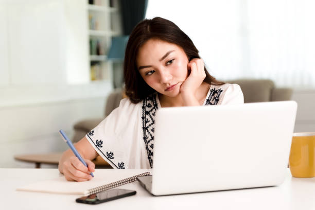 istock Asian woman working from home. Stress. 1256464872